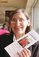 Kathy Graff holding client brochure